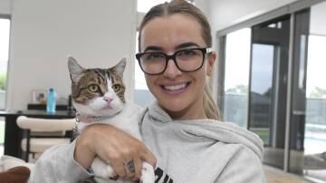 Elli Edwards with her beloved cat, Mollie, 9, who was found four years after going missing. Picture by Lachlan Bence