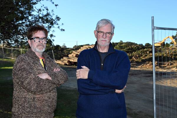 Black Hill residents John Wrigglesworth (left) and Julian Whitta at the site of the removed pine trees. Picture by Kate Healy