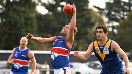 Daylesford recruit Trent Lee take possession in front of Dylan Harberger (Learmonth) at Learmonth on Saturday. Picture by Adam Trafford.