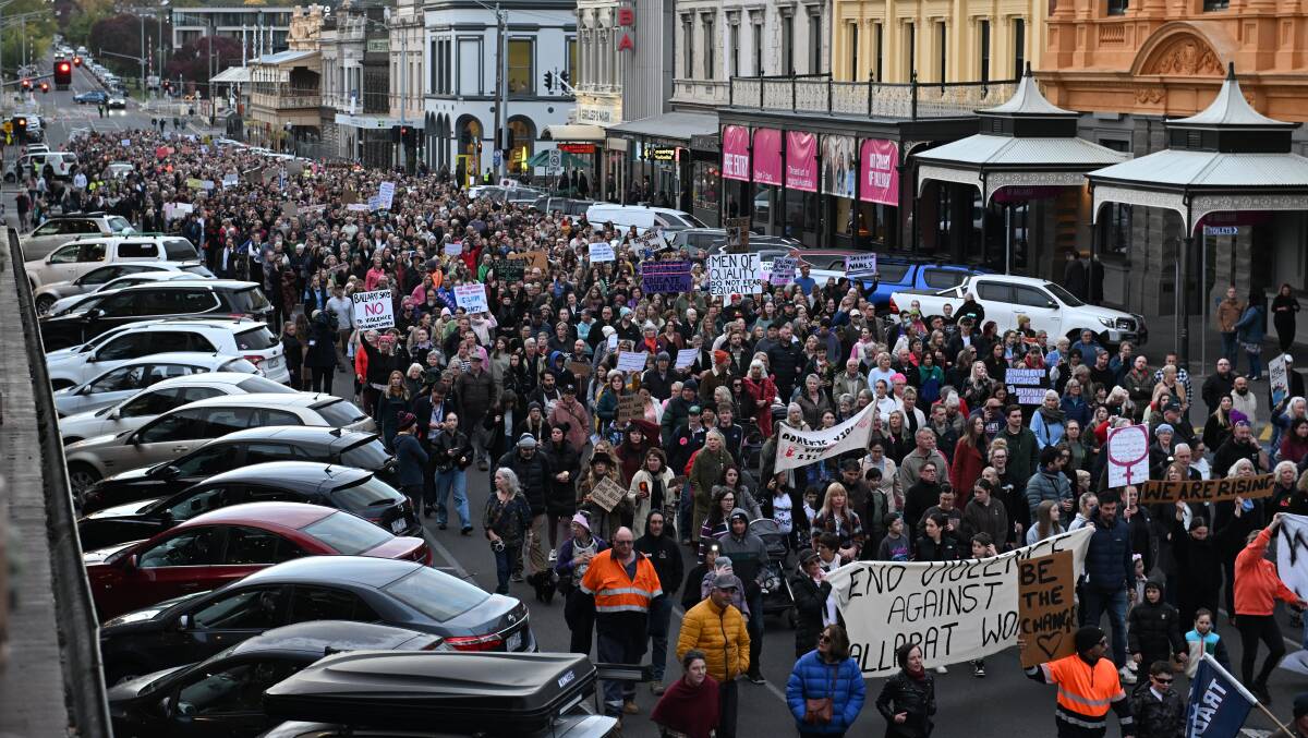 Crowds march down Lydiard Street. Picture by Lachlan Bence