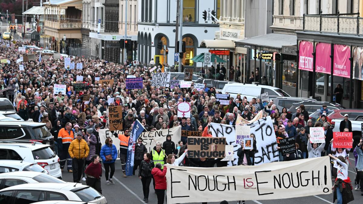 Crowds march down Lydiard Street. Picture by Lachlan Bence