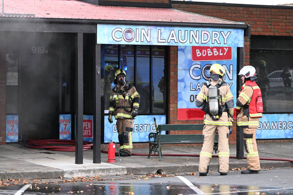 Firefighters at a laundromat on Macarthur Street. Picture by Lachlan Bence