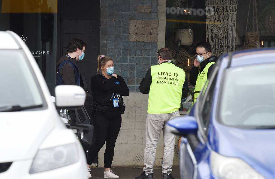 Lookout: DHHS authorised officers and police visited businesses in Daylesford on Saturday. Picture: Kate Healy