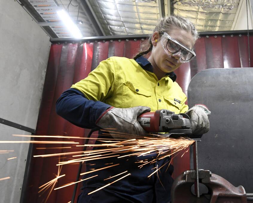 SPARKS: Sarah Cudmore is one of the few women working on the floor at Maxi Trans where she is completing a welding apprenticeship and Cert III in engineering and fabrication. Picture: Lachlan Bence