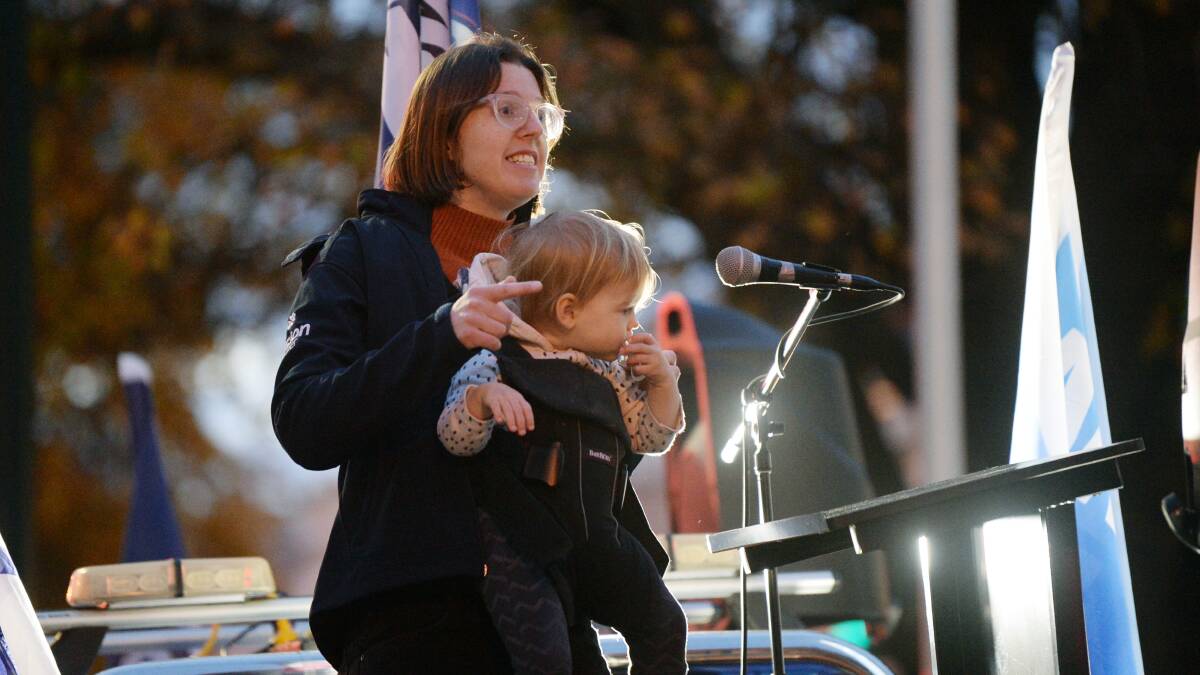 ASU campaigner Zoe Edwards, along with 18 month old Macaulay Rae, speaks at the Ballarat staff rally. Picture by Kate Healy