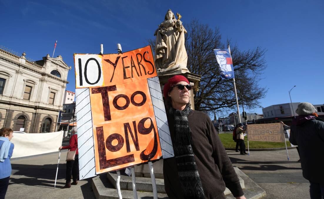 Patrick van Raaphorst participates in a vigil at Queen Victoria Square. Picture by Lachlan Bence