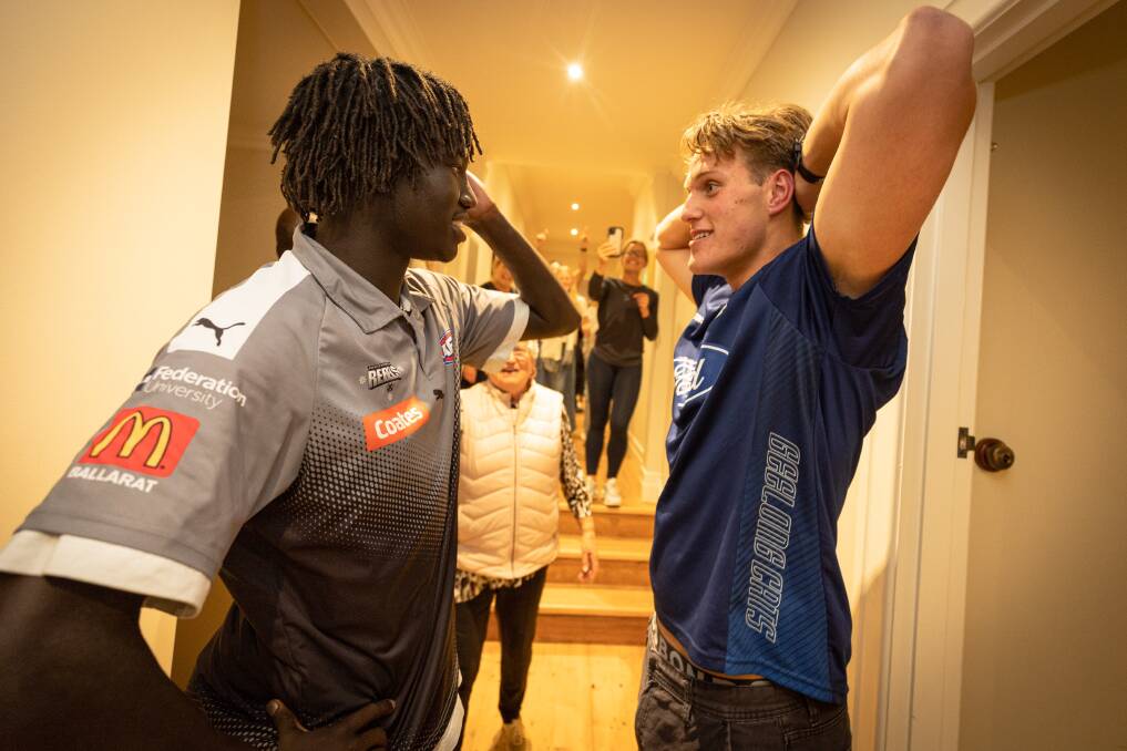 Luamon Lual and George Stevens catch up after both were drafted to AFL clubs. Picture by Sean McKenna