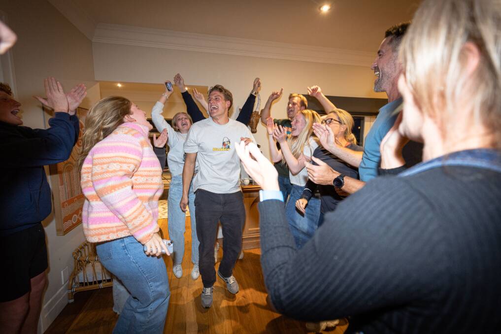 George Stevens celebrates with family and friends after being drafted to Geelong. Picture by Sean McKenna