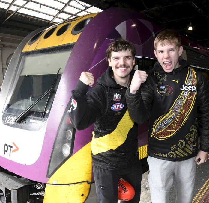 Richmond fans Brock Goldsworthy and Darcy Gray at Ballarat Station on Friday before making their way into Melbourne for a match. Picture by Lachlan Bence. 