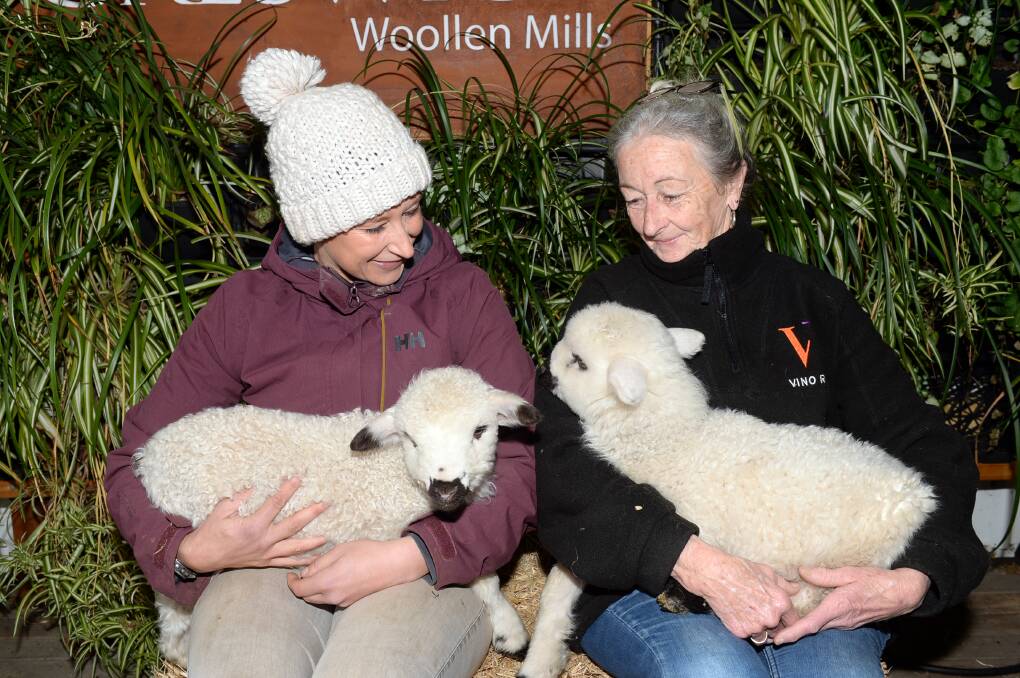 Creswick Woollen Mills farmer Nioka Wozny with her mum Lyn Wozny and the twin valais lambs.