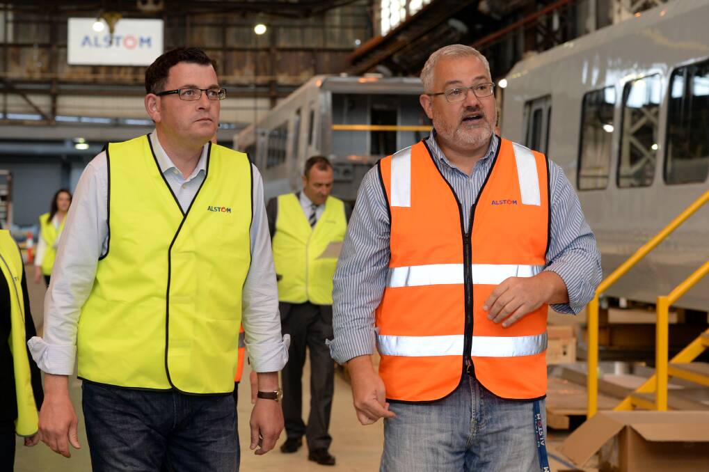 Daniel Andrews and Alstom site managing director Jim Morris pictured in October 2014. Picture by Kate Healy