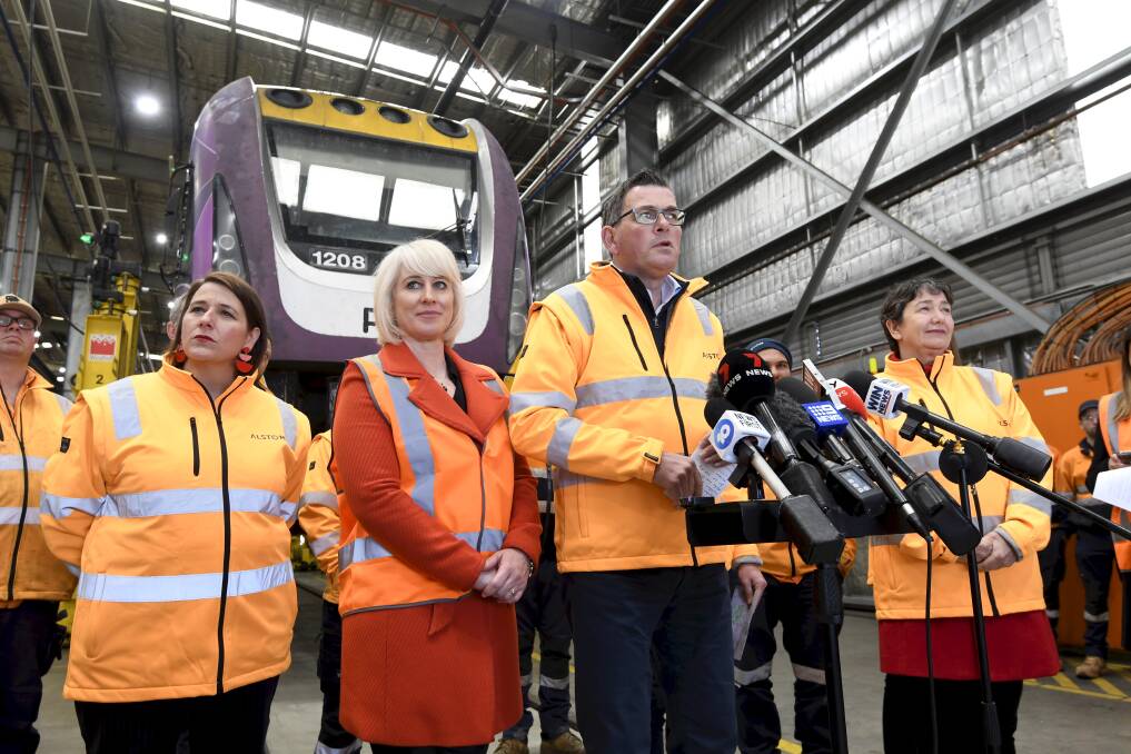 Labor promises capped V/Line fares during 2022 election. Daniel Andrews with his wife Catherine and local members Juliana Addison and Michaela Settle at Bombardier in Ballarat East. 
