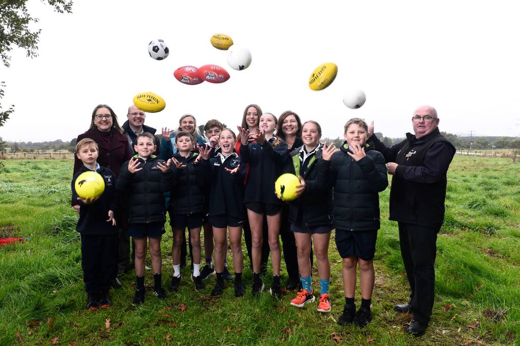 Premier Jacina Allan, Ripon MP Martha Haylett MP and Ballart major Des Hudson with students from Miners Rest Primary School at the announcement of their new sporting facilities. Picutre by Adam Trafford 