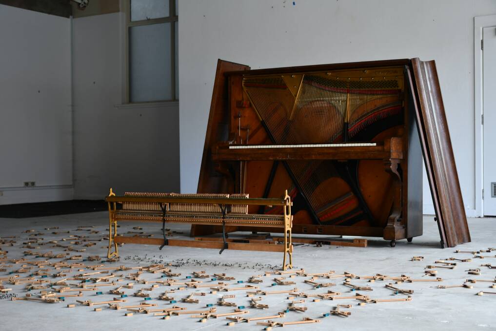 An old piano taken apart and laid out as part of stop-motion works for Rae Howell's residency. Picture by Nieve Walton.