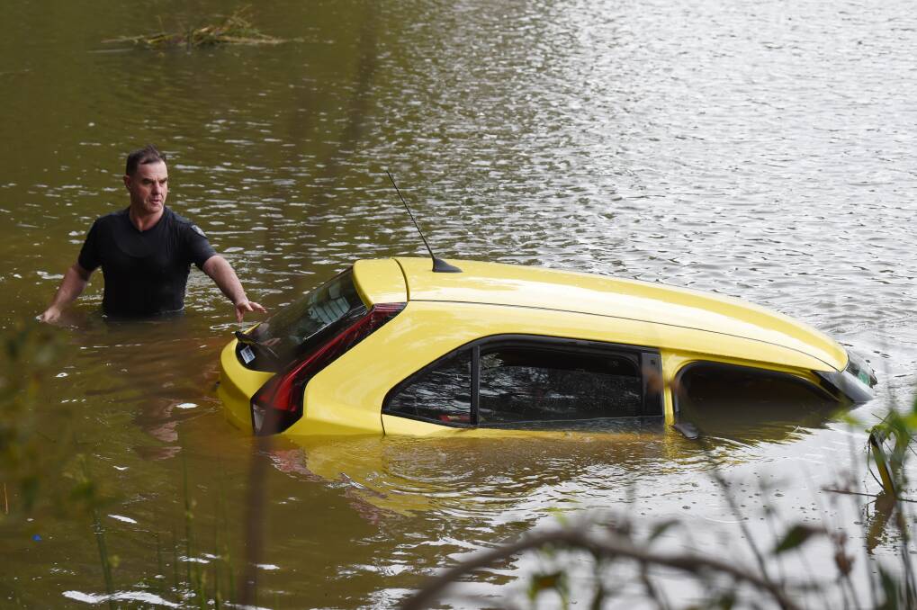 Leading Senior Constable Simon Barker saved a woman from this sinking car at Creswick in 2019. He will now receive an award for bravery. Picture by Kate Healey.