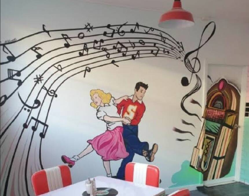 The finished mural in the rear dining area of Shezza's Diner Ballan. The image is based on Cheryle and Dennis in their younger years. Picture by D Azzopardi.