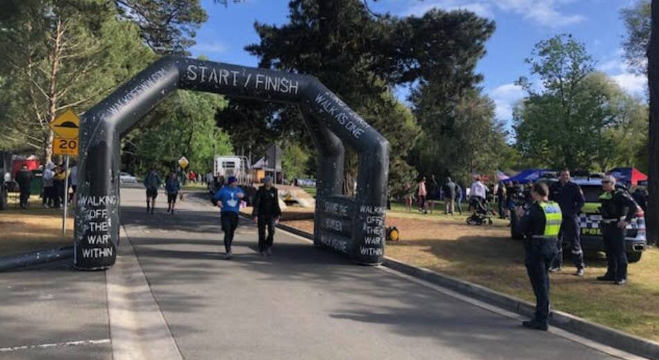 Police and their supporters mere among the emergency and defence personnel who crossed the WOTWW finish line at Lake Wendouree. Picture Victoria Police. 