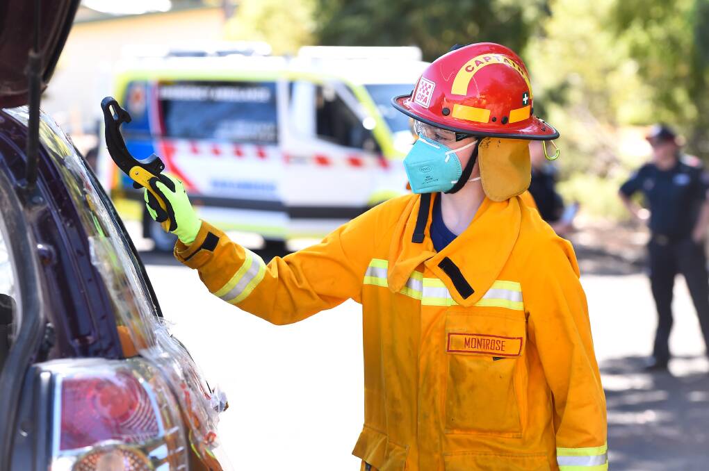 Anabelle gets the honours of cracking the window open on a wreck donated by Ballarat Towing. Girls on Fire program aims to introduce young females to firefighting and other emergency work. Picture by Adam Trafford.