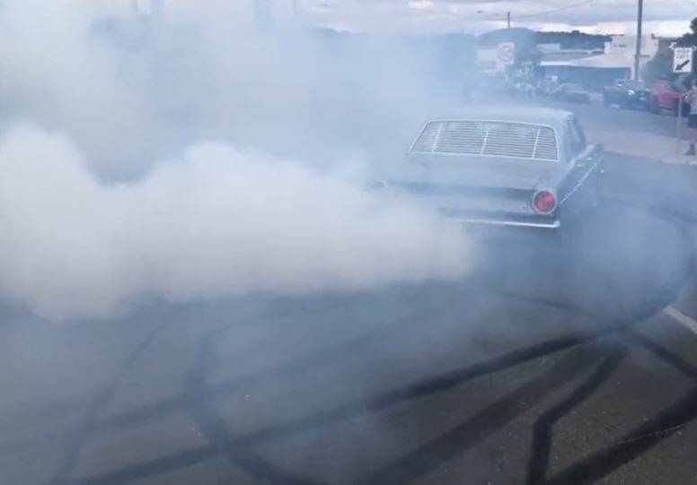 Under thick thick layer of smoke on Howitt Street, there's a Falcon containing at least four people leaving Saturday's Street Speed Mayhem at the Ballarat Showgrounds. Picture supplied. 