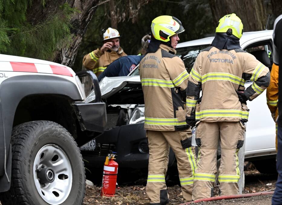 Emergency services work to free a woman who was trapped after crashing into a tree on Smythesdale-Snake Valley Road in Hillcrest. Picture by Lachlan Bence