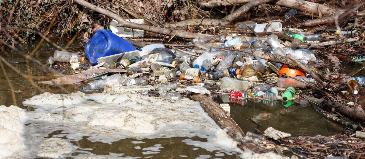 Recyclable plastic water bottles and aluminium cans are often found polluting the Yarrowee River. Picture by Luke Hemer