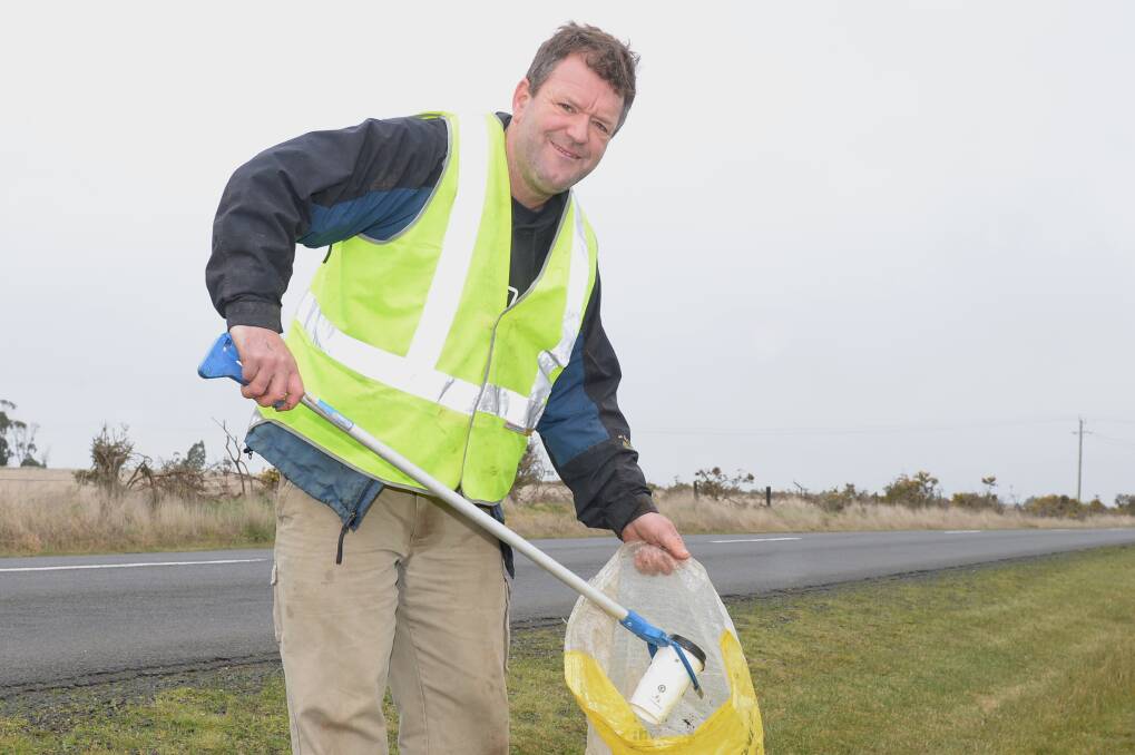 Phoenix College teacher and 'Community Hero' award nominee Brendan Johnston picks up rubbish on the roads around Bonshaw. Picture by Kate Healy