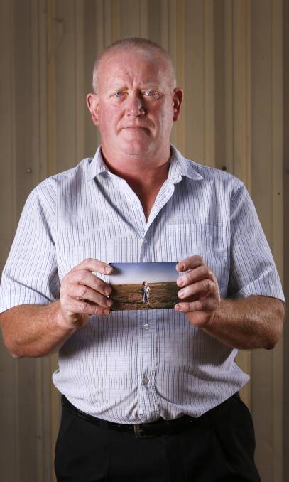 EVERY RIBBON HAS A FACE: Clergy abuse survivor Dominic Ridsdale holds a childhood photo of himself in the hope other victims will seek help. Picture: Luka Kauzlaric
