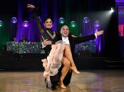 Stephen Armati, partnered by Emma Learmonth, dancing the Quickstep.  