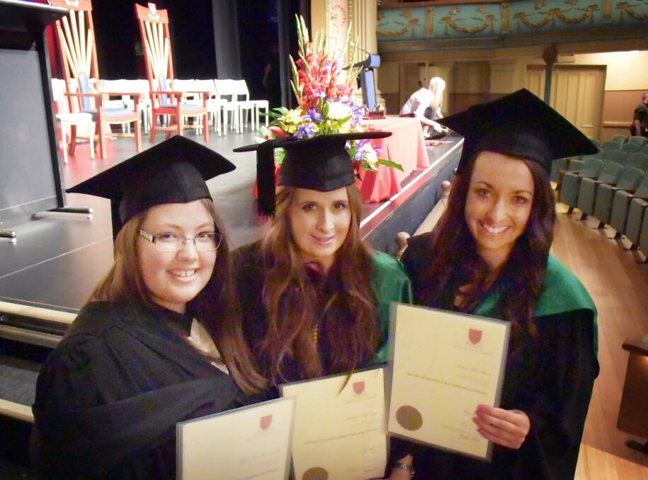 Dreams come true: Kayla Bradley, Sharlene Cooper and Jessica Arcer proudly show off their long-aspired degrees in early childhood and primary education.