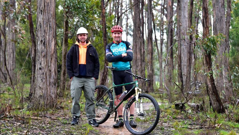 Hepburn Shire Council Creswick Trails Network construction manager Mick McCallum and trail enthusiast Mick Veal in bushland near Creswick. Picture by Brendan McCarthy