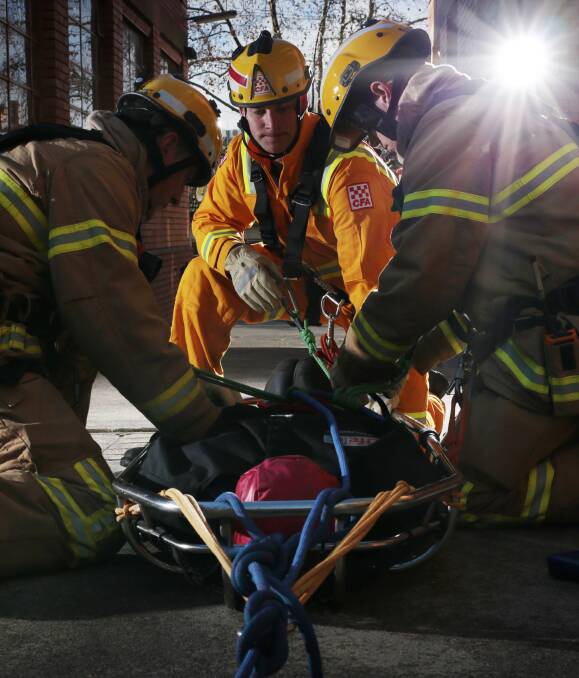 ROPE RESCUE: Ballarat City Fire Brigade firefighters Tim O'Loughlin, Morgan Mitchell and Andrew Beckett haul a patient to safety during training. Picture: Luka Kauzlaric 