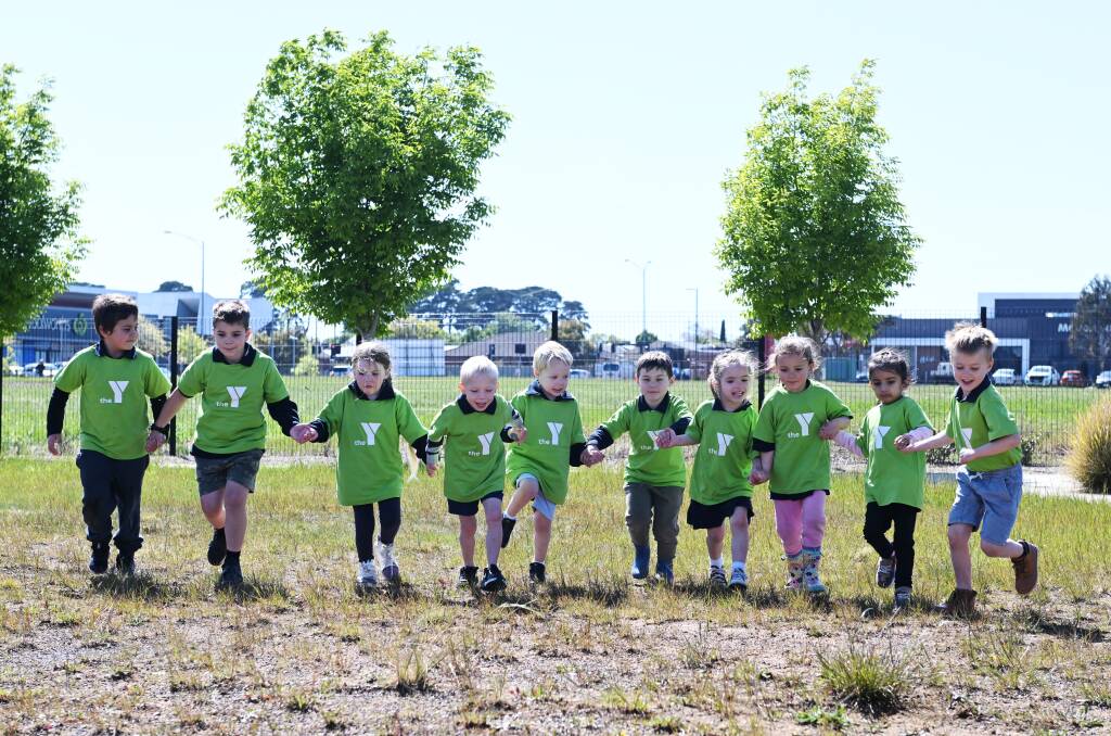 Children from The Y's Lucas Kindergarten work together in getting ready to Run for a Cause this November. Picture by Kate Healy