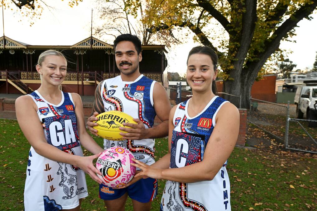 East Point's Lily McGuinness, Mickitja Rotumah-Onus and Isabella Stevens prepare to wear the club's new Indigenous jumpers, designed by Shakira Winmar, at Eastern Oval on Saturday. Picture by Lachlan Bence