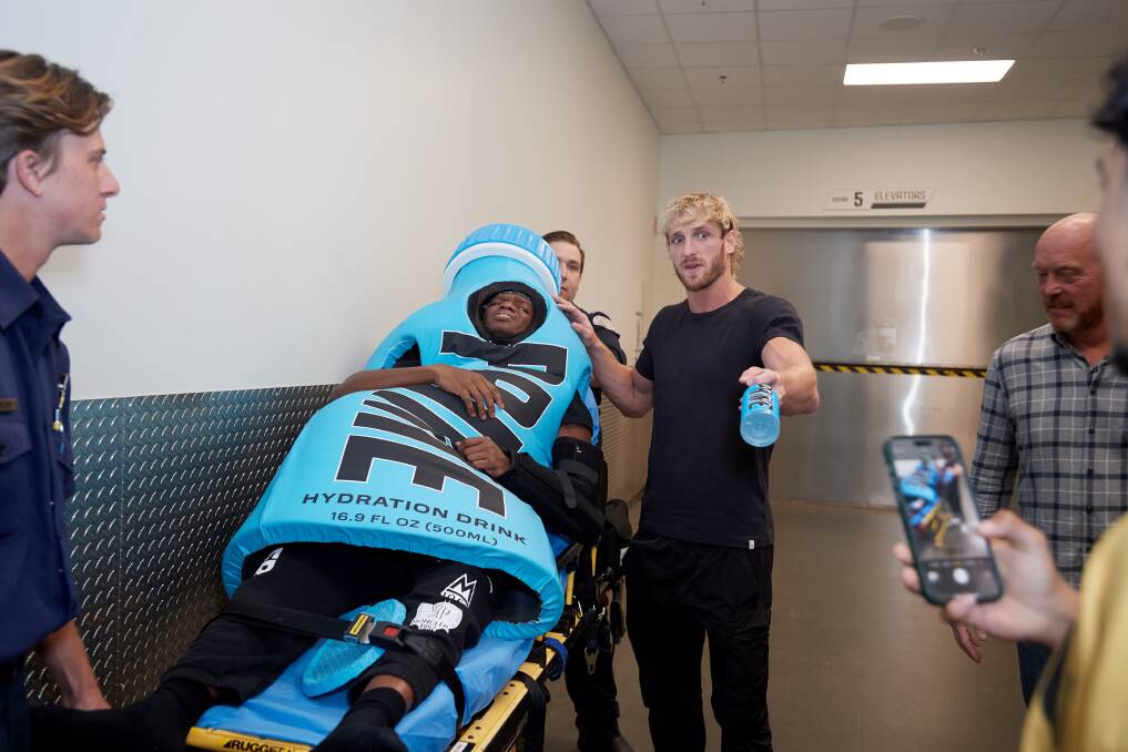An "injured" KSI, dressed as a Prime Hydration bottle, and Logan Paul, with a matching drink, have their Wrestlemania moment to post on socials this year. Picture Getty Images
