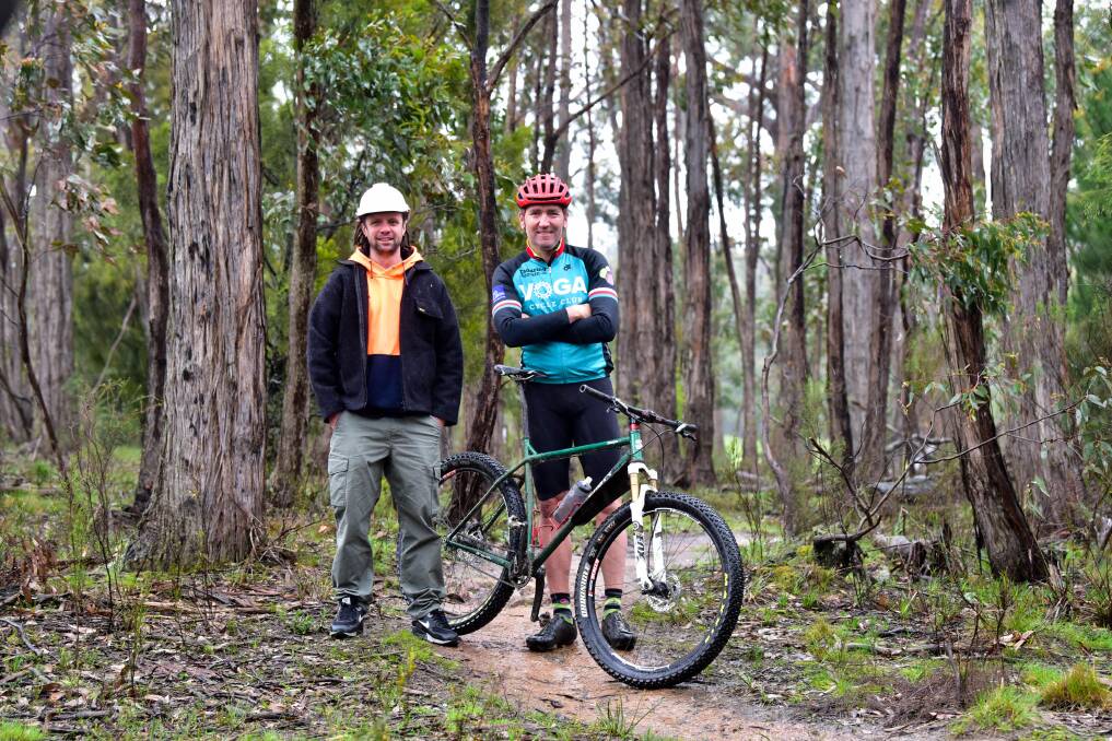 Hepburn Shire Council Creswick Trails Network construction manager Mick McCallum and trail enthusiast Mick Veal in bushland near Creswick in 2019. Picture by Brendan McCarthy