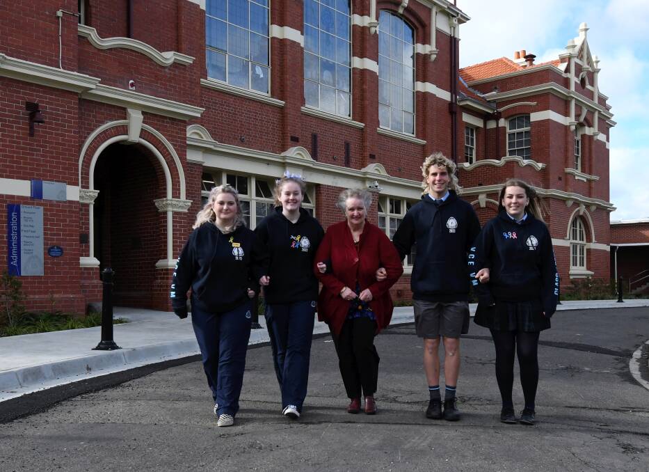 Ballarat High School vocational major year 12s Savannah, Chloe, Nicholas and Ebony link up with alumna Gail Elsey to support Fiona Elsey Cancer Research Institute. Picture by Lachlan Bence