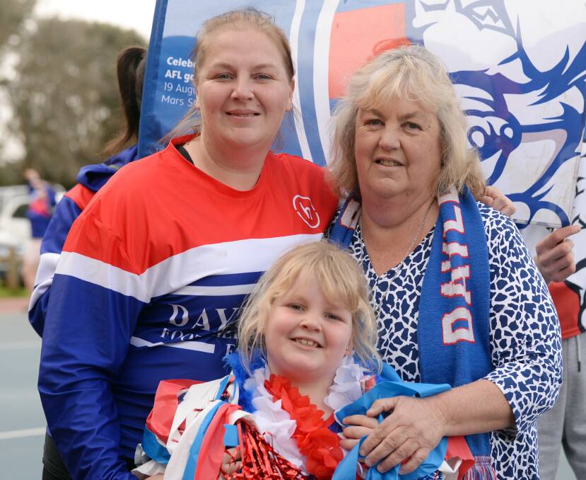 Emily Heywood and Joy Heywood, along with third-generation Ella Pearson, age seven, have been passionate about Daylesford netball since the Bulldogs joined the league in 2006, building up from juniors. Picture by Kate Healy