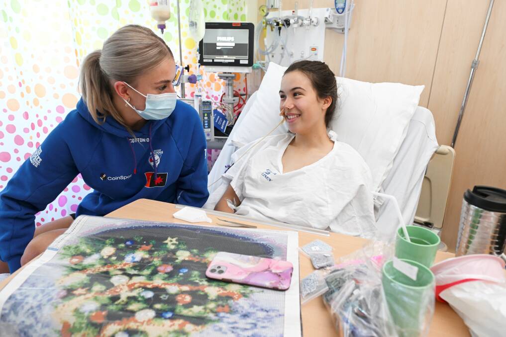 Western Bulldogs number one draft pick Kristie-Lee Weston-Turner chats with Isabella Ebenwaldner, a patient in Grampians Health Ballarat Base Hospital children's ward. Picture by Lachlan Bence