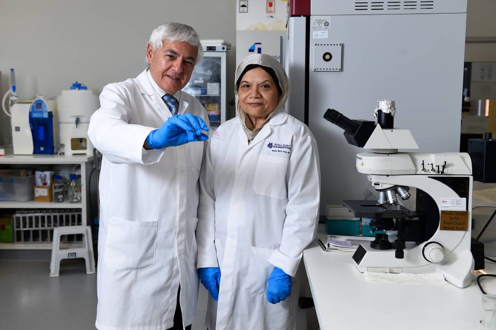 Fiona Elsey Cancer Research Institute director George Kannourakis with Professor Nuzhat Ahmed celebrate a step in tackling ovarian cancer. Picture by Adam Trafford