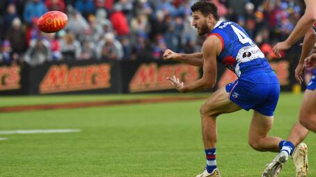 We are relying on Western Bulldogs, led by captain Marcus Bontempelli, to keep their 'unflinching' alignment as professional sports turn back from regional Victoria. Picture by Kate Healy