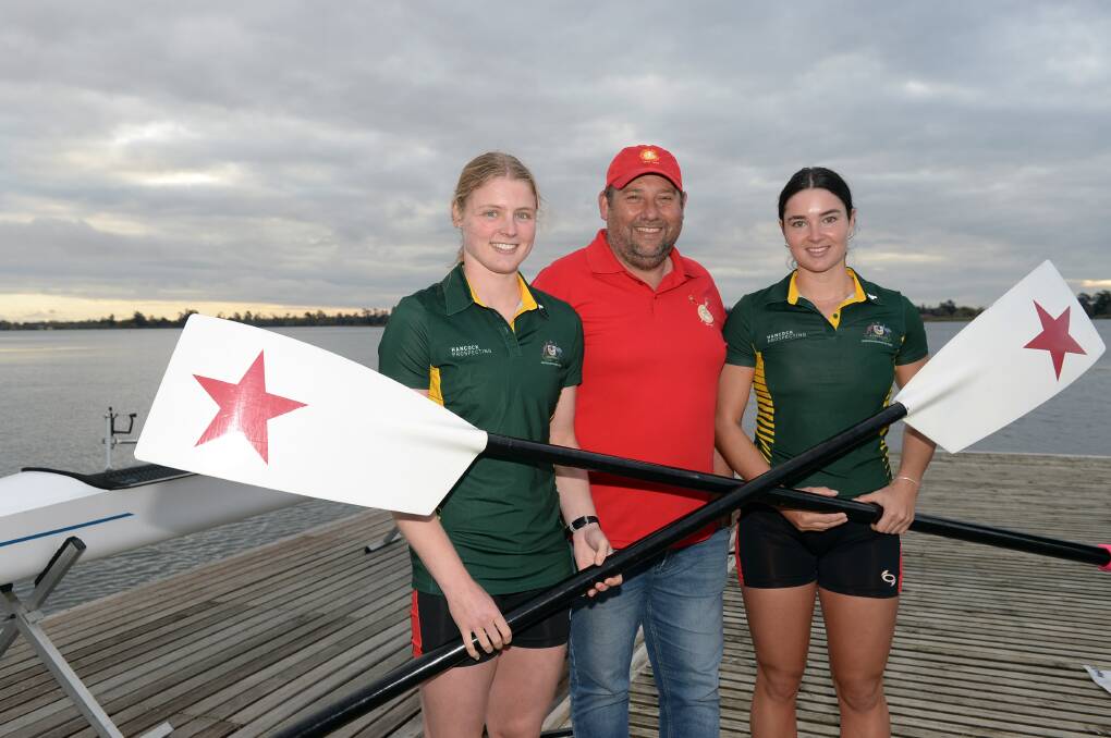 Rowing coach Jamie McDonald with Lucy Richardson and Katie Jackson on the deck ahead of their World Under-19 Rowing Championship venture. Picture by Kate Healy