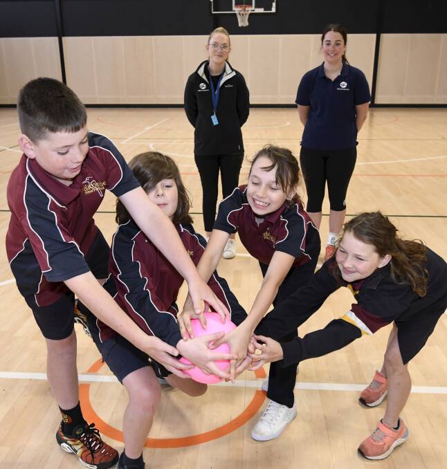 Delacombe Primary School grade five pupils Mason, James, Lexi and Zahlia get involved in a game of dodgeball under mentorship of Sports Central's Sabelle McSparron and Holly Jeffrey. Picture by Lachlan Bence
