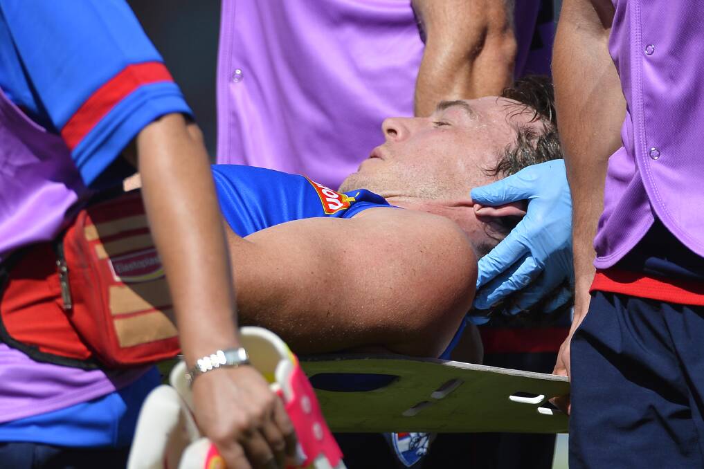 Western Bulldog Liam Picken is stretchered from the Mars Stadium after being knocked out in a marking contest in a 2018 pre-season match. Picture by Dylan Burns