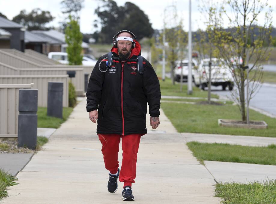 STARTING OUT: Alan Thorpe starts training about Ballarat last October and becomes well-known for his thick Essendon jacket. Picture: Lachlan Bence