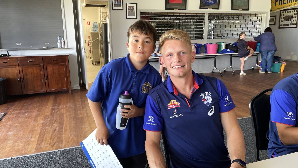 Sebastopol grade five Brock has a chat with Bulldogs' star Adam Treloar, who says it is great to chat more individually with young fans. Picture by Melanie Whelan