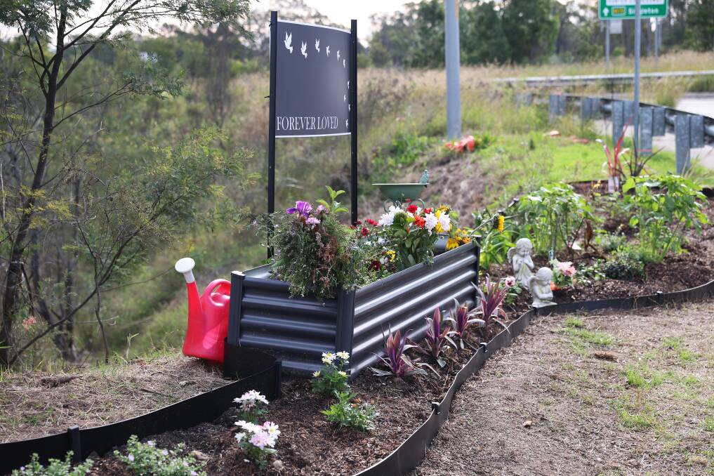 A memorial garden has been nurtured at the scene of the bus rollover. Picture by Peter Lorimer