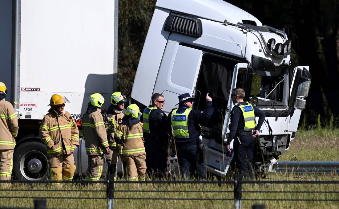 Police check out the crashed truck on Friday, October 27. Picture by Lachlan Bence
