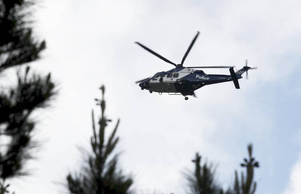 A police chopper over Ballarat. Picture by Lachlan Bence