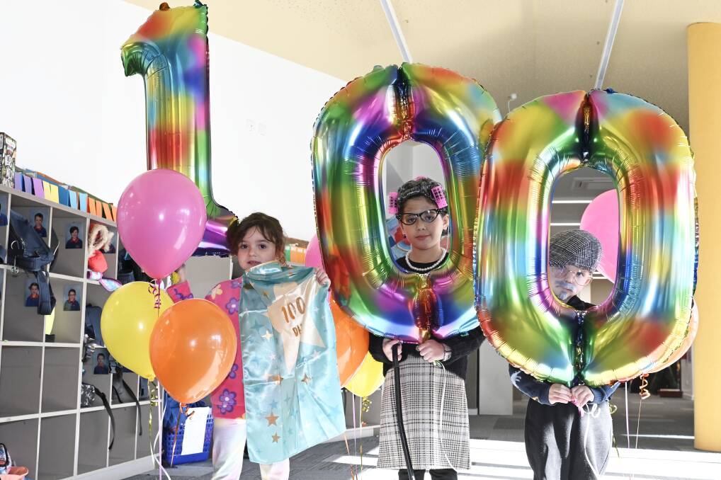 Forest Street Primary pupils Bella, Letti and Oliver celebrate reaching 100 days of school. Picture by Lachlan Bence