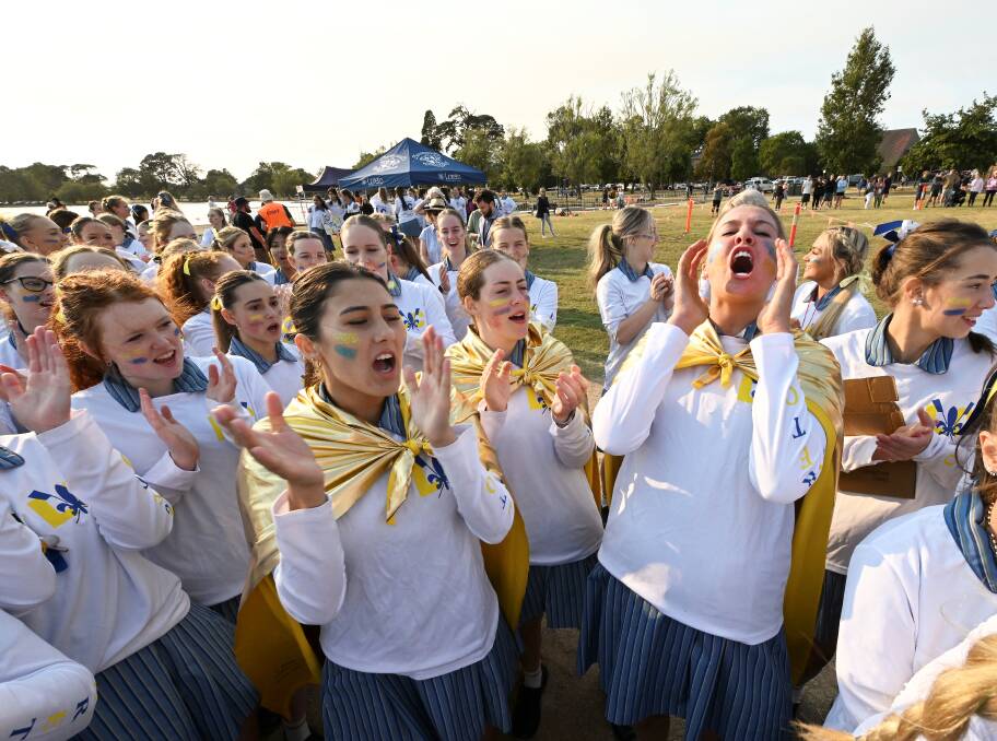 Gold-clad Loreto spit crew captains Scarlett Hay, Reagan Sheenan, Lara Antrobus are about 'bringing the energy'. Picture by Lachlan Bence